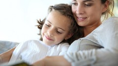 bigstock-Mom-with-little-girl-reading-b-53339449