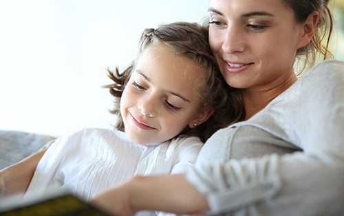 bigstock-Mom-with-little-girl-reading-b-53339449
