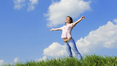 happy young woman dreams to fly on winds